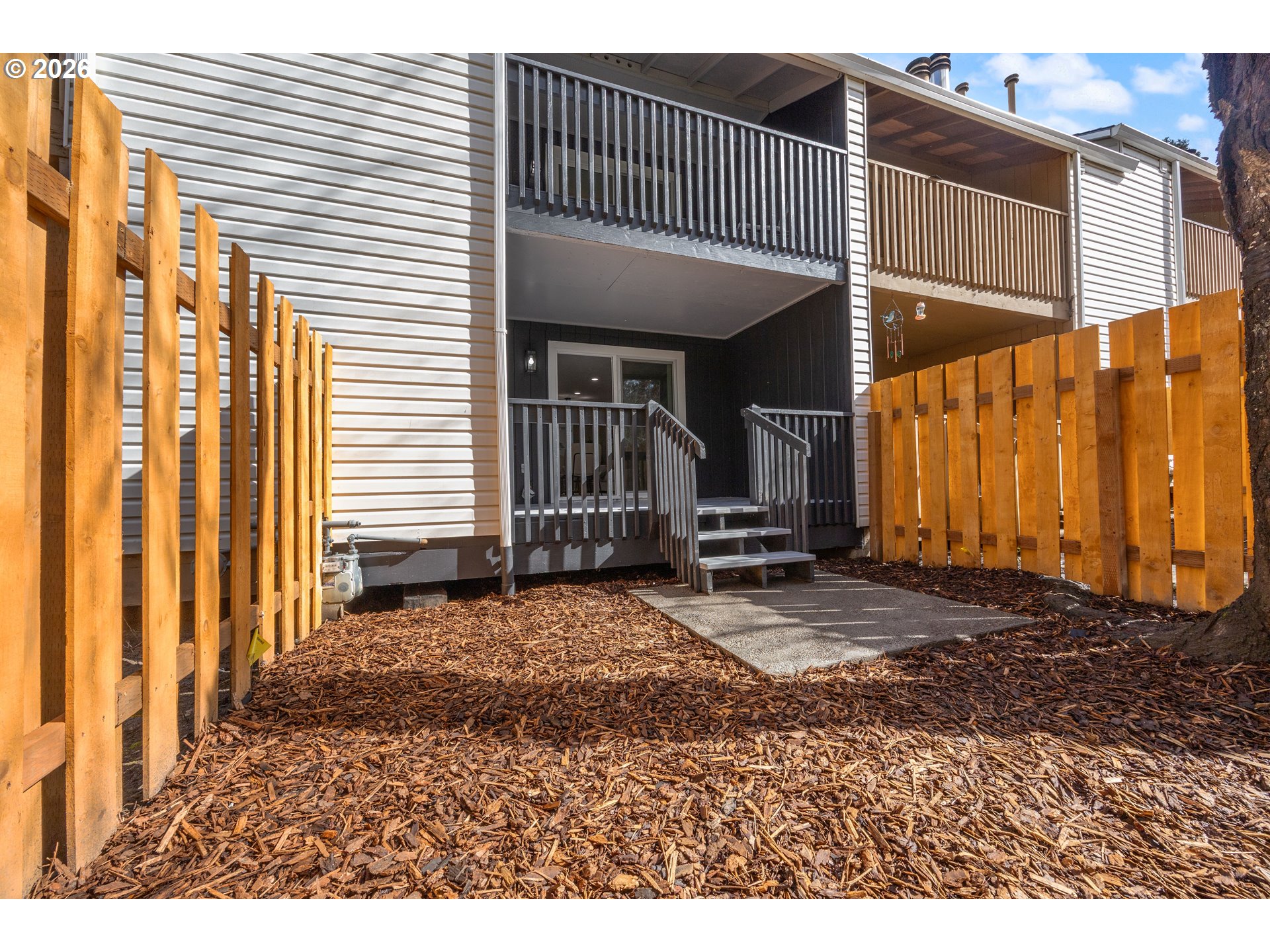 4921 Southwest 59th Avenue, Unit 6 Portland, OR 97221 - Photo 20 of 23 a view of a house with a patio
