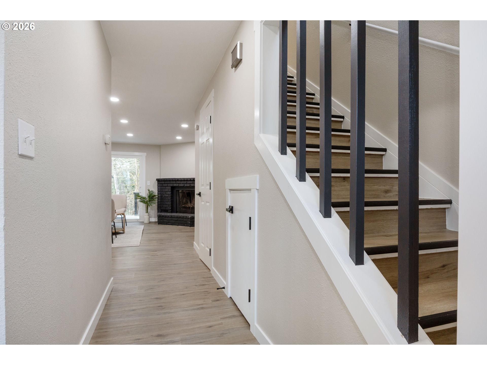 4921 Southwest 59th Avenue, Unit 6 Portland, OR 97221 - Photo 3 of 23 a view of entryway and hall with wooden floor
