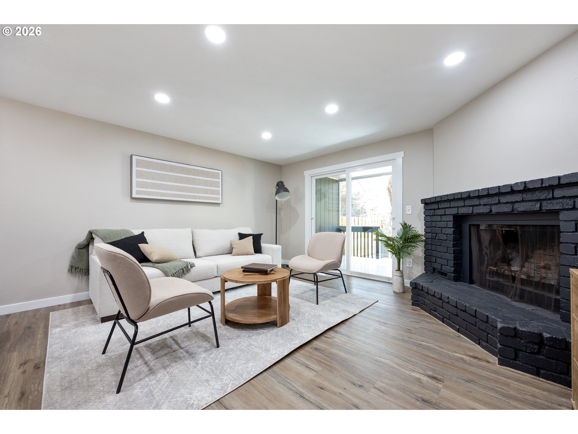 4921 Southwest 59th Avenue, Unit 6 Portland, OR 97221 - Photo 4 of 23 a living room with furniture and a fireplace