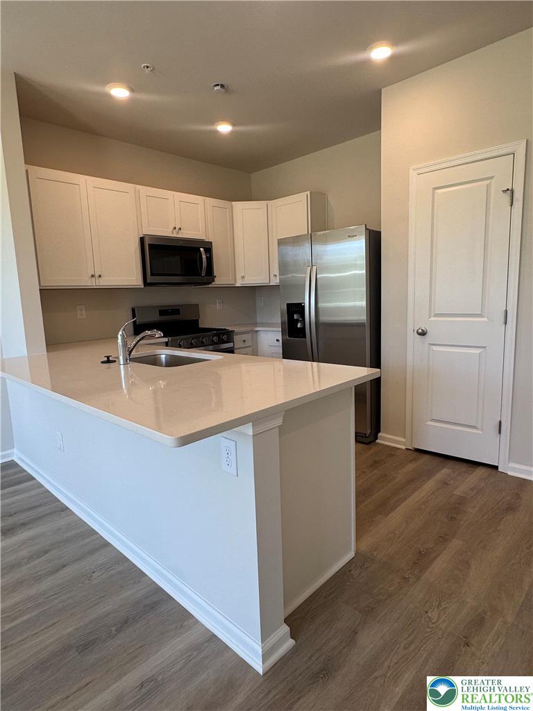1168 Martin Road Breinigsville, PA 18031 - Photo 2 of 11 A well-appointed kitchen features a central island with a sink and ample cabinet space.