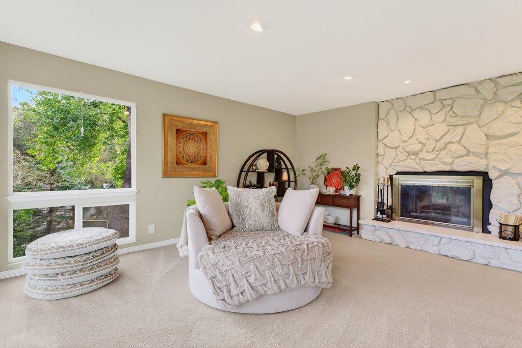 2907 Granite Creek Road Scotts Valley, CA 95066 - Photo 12 of 68 a living room with furniture a fireplace and a flat screen tv