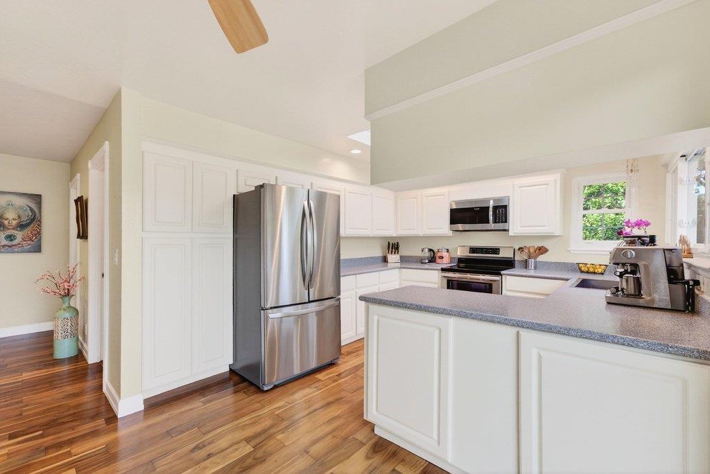 2907 Granite Creek Road Scotts Valley, CA 95066 - Photo 16 of 68 a kitchen with stainless steel appliances a refrigerator sink and microwave