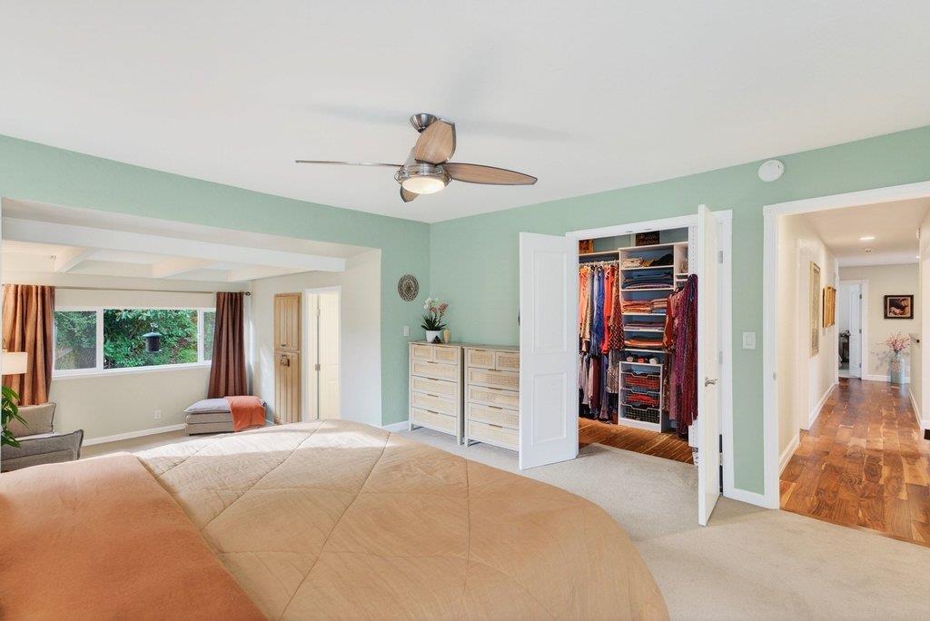 2907 Granite Creek Road Scotts Valley, CA 95066 - Photo 22 of 68 a bedroom with a bed and a chandelier