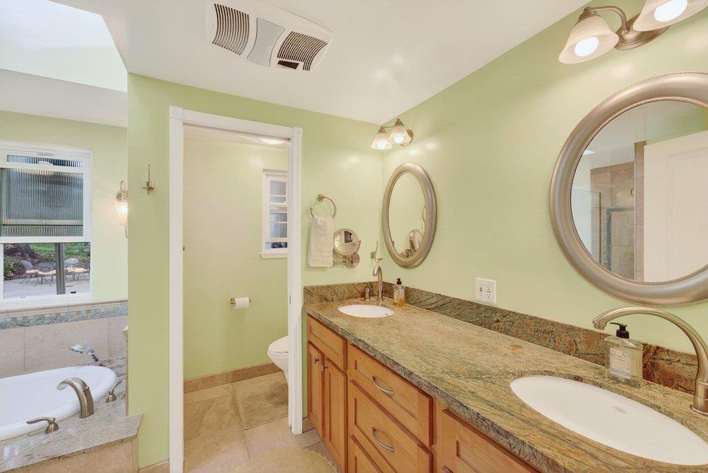2907 Granite Creek Road Scotts Valley, CA 95066 - Photo 26 of 68 a bathroom with a granite countertop double vanity sink and a mirror