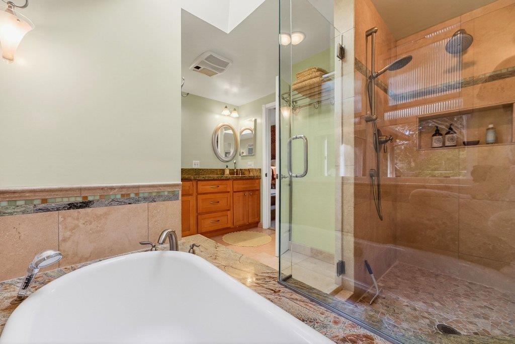 2907 Granite Creek Road Scotts Valley, CA 95066 - Photo 27 of 68 a bathroom with a tub a sink and mirrors