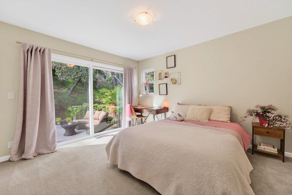 2907 Granite Creek Road Scotts Valley, CA 95066 - Photo 31 of 68 a bedroom with a bed and glass window