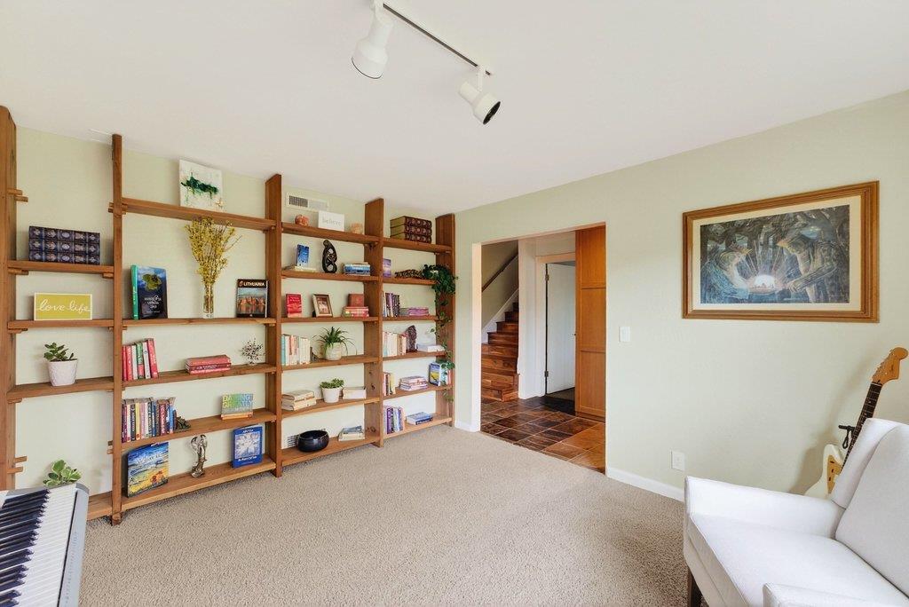 2907 Granite Creek Road Scotts Valley, CA 95066 - Photo 36 of 68 a bedroom with furniture and a book shelf