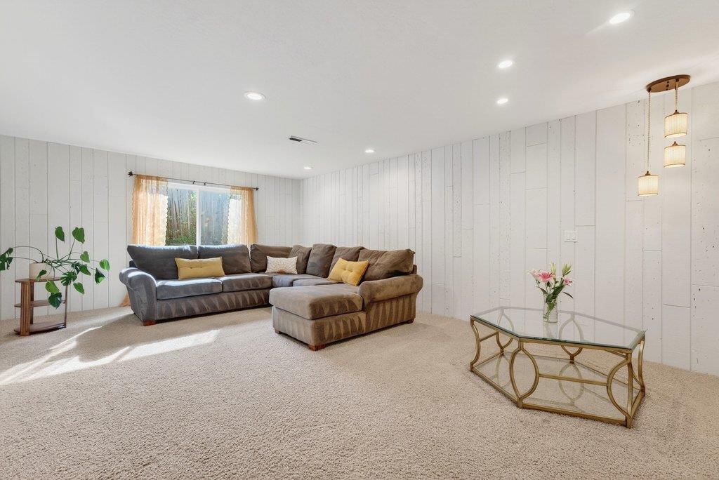 2907 Granite Creek Road Scotts Valley, CA 95066 - Photo 38 of 68 a living room with furniture and flowers