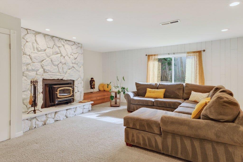 2907 Granite Creek Road Scotts Valley, CA 95066 - Photo 39 of 68 a living room with furniture a fireplace and a flat screen tv