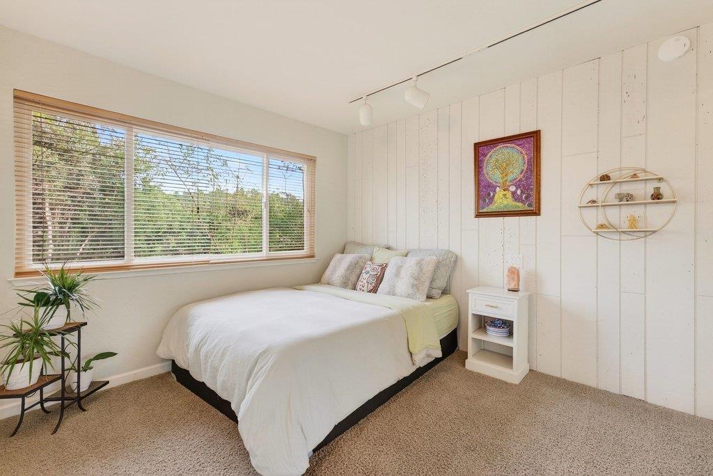 2907 Granite Creek Road Scotts Valley, CA 95066 - Photo 40 of 68 a bedroom with a bed painting on wall and a large window