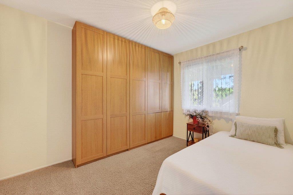 2907 Granite Creek Road Scotts Valley, CA 95066 - Photo 41 of 68 a bedroom with a bed and a window