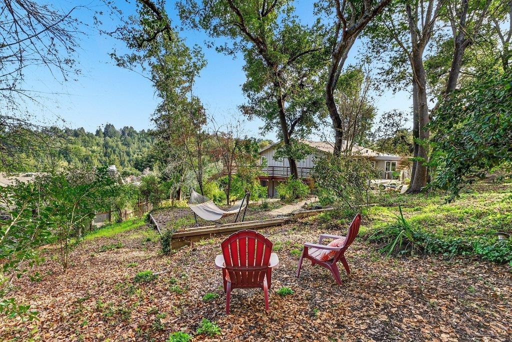 2907 Granite Creek Road Scotts Valley, CA 95066 - Photo 57 of 68 a backyard of a house with table and chairs