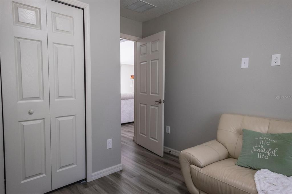 12569 Southwest 73rd Street Ocala, FL 34481 - Photo 15 of 28 a living room with furniture and a wooden floor