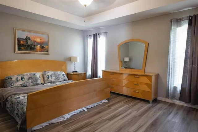 a bedroom with bed and window