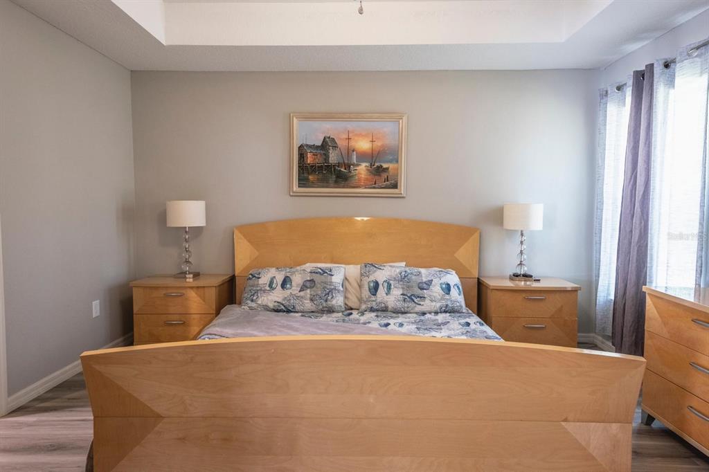 12569 Southwest 73rd Street Ocala, FL 34481 - Photo 17 of 28 a bed sitting in a bedroom next to a window