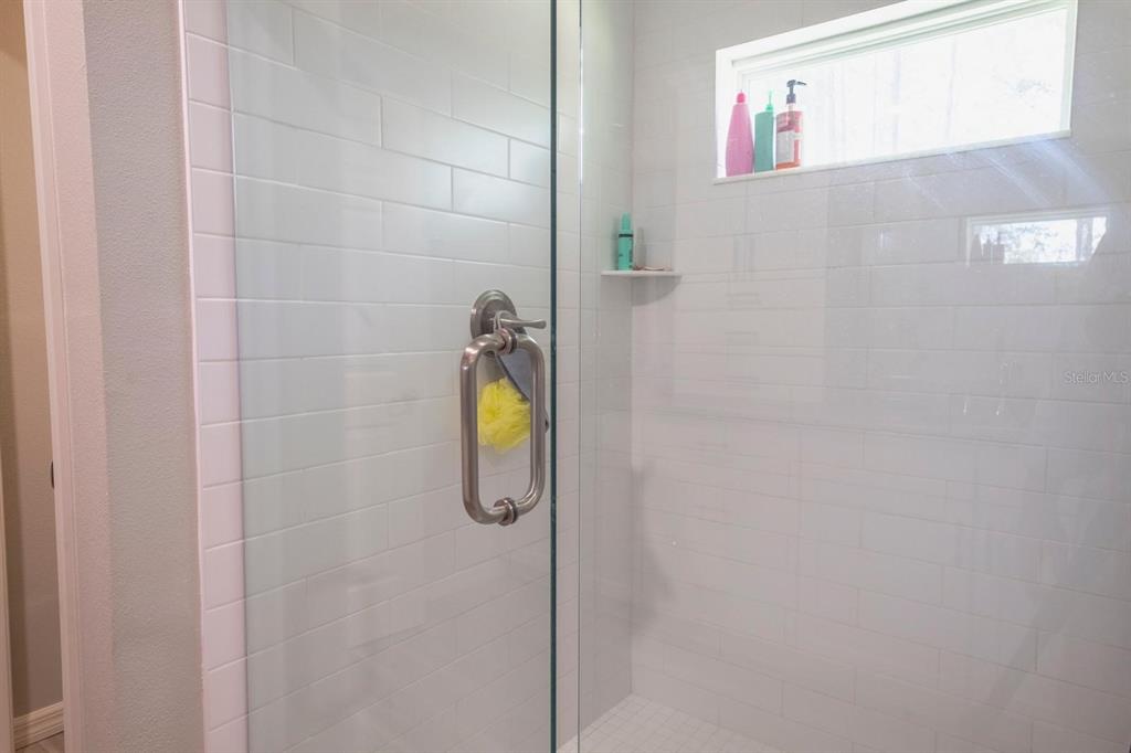 12569 Southwest 73rd Street Ocala, FL 34481 - Photo 22 of 28 a bathroom with a shower