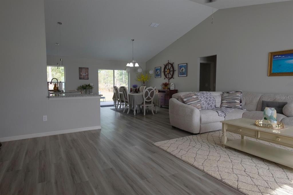12569 Southwest 73rd Street Ocala, FL 34481 - Photo 5 of 28 a living room with furniture and wooden floor