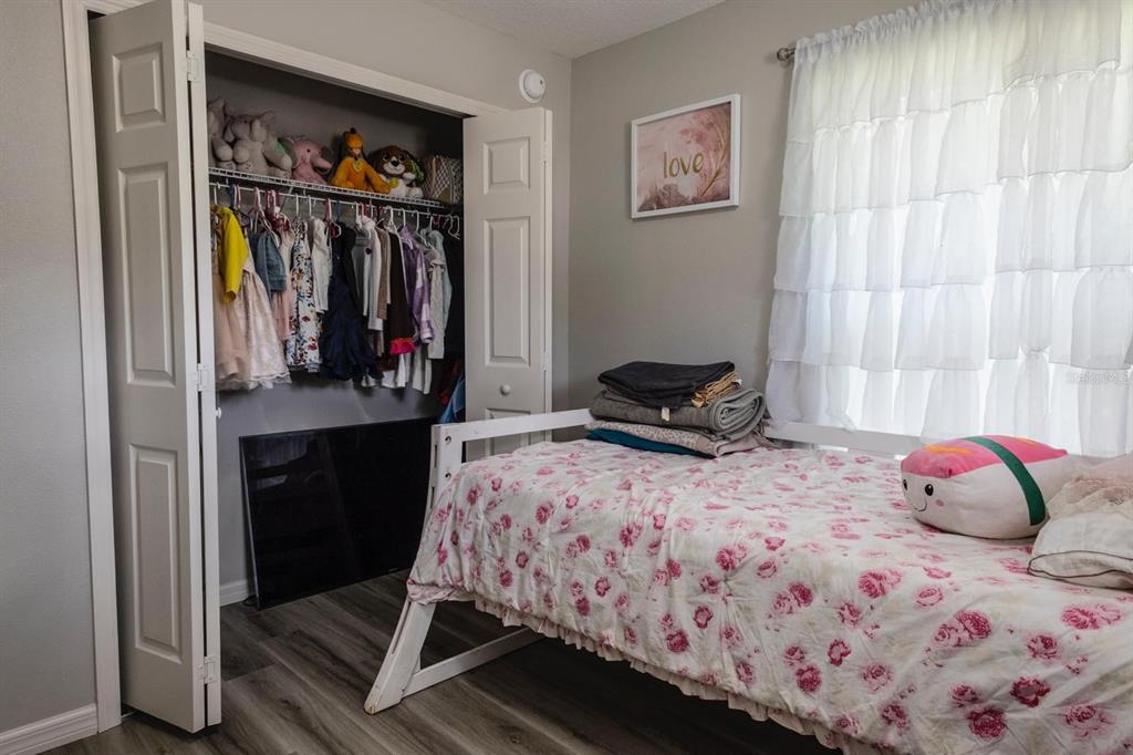 12569 Southwest 73rd Street Ocala, FL 34481 - Photo 10 of 28 a bedroom with a bed and a window