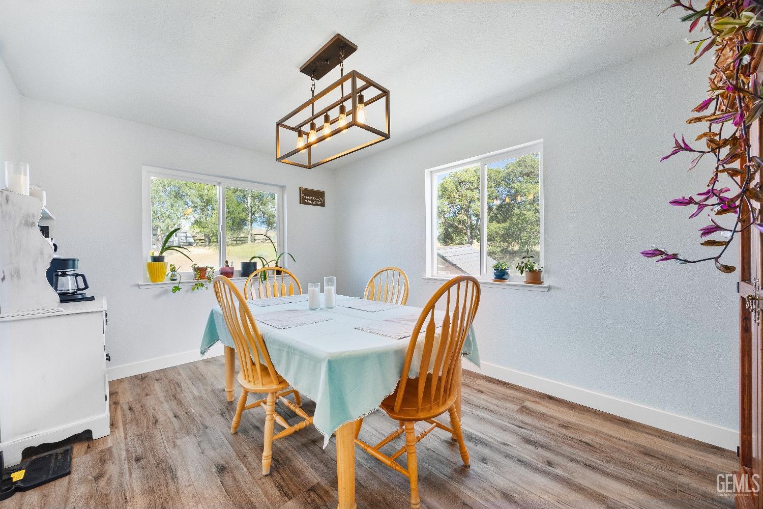 Undisclosed Address Tehachapi, CA 93561 - Photo 11 of 46 a view of a dining room with furniture window and wooden floor