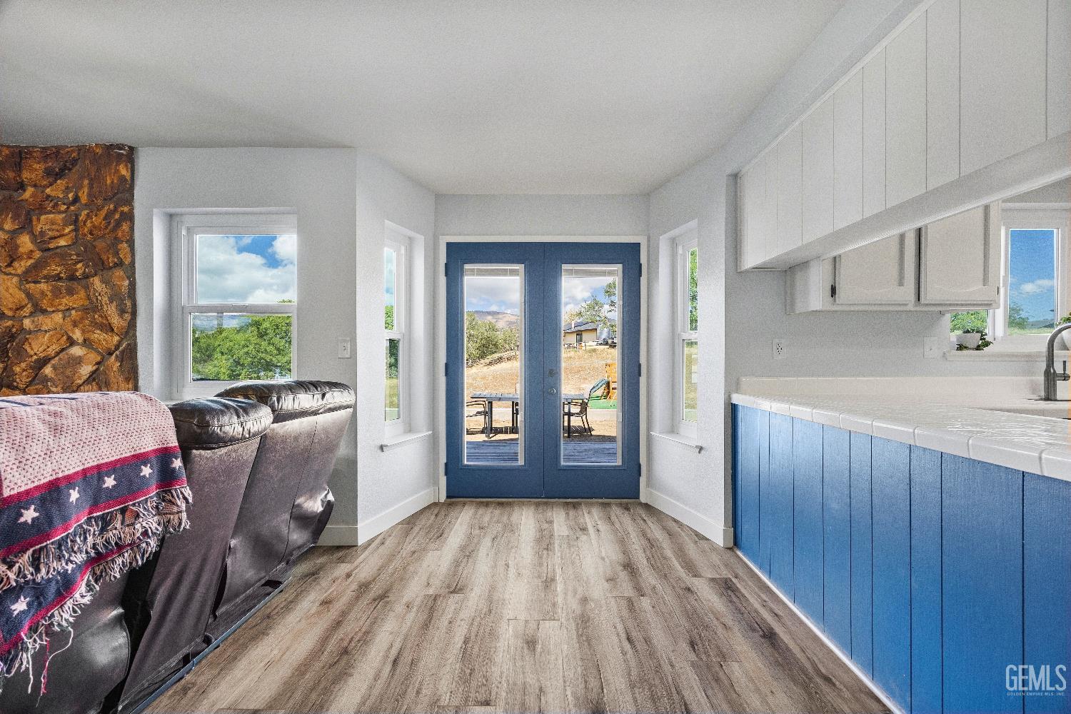 Undisclosed Address Tehachapi, CA 93561 - Photo 12 of 46 a view of a kitchen with furniture and wooden floor