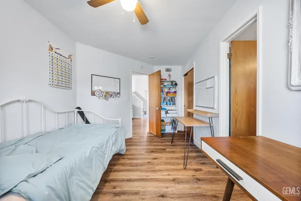 a bedroom with furniture and a window