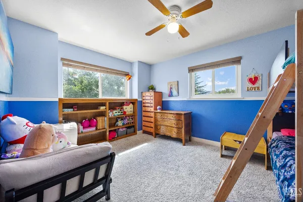 a bed room with a bed and a couch