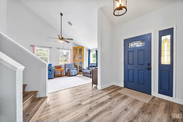 a living room with furniture and windows