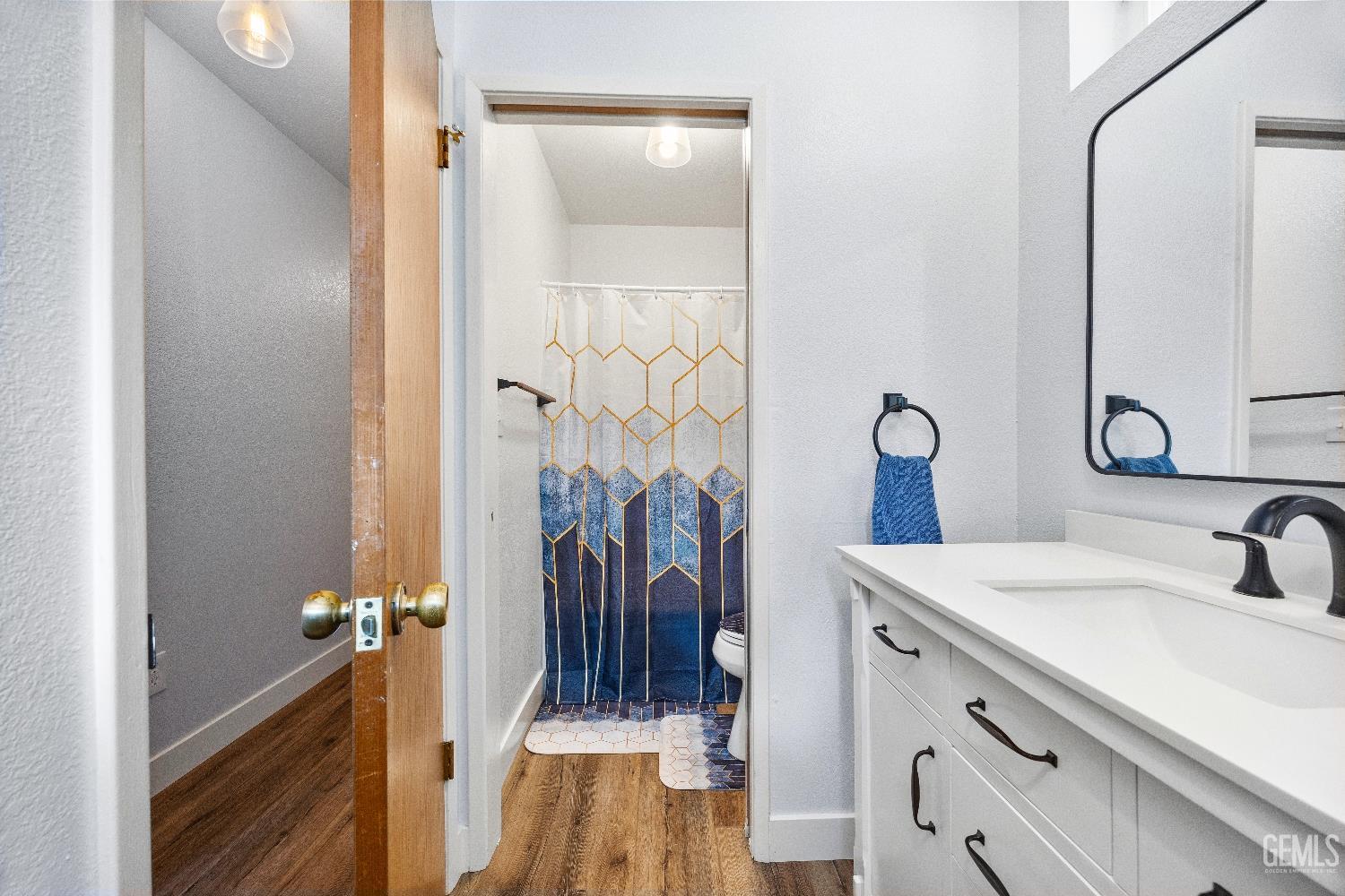 Undisclosed Address Tehachapi, CA 93561 - Photo 32 of 46 a bathroom with a sink a mirror and shower