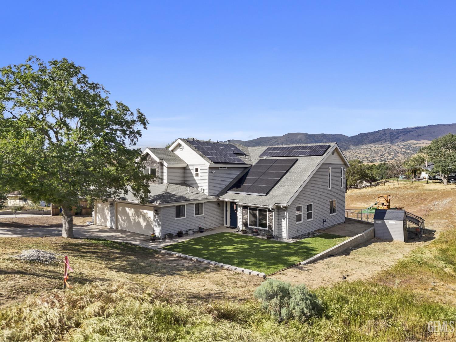 Undisclosed Address Tehachapi, CA 93561 - Photo 35 of 46 a view of a big house with a big yard plants and large trees