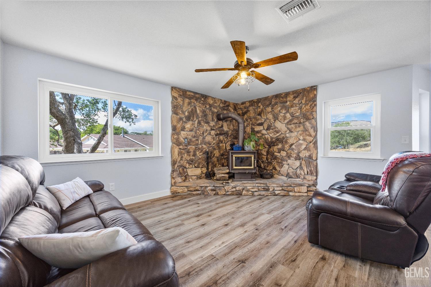 Undisclosed Address Tehachapi, CA 93561 - Photo 7 of 46 a living room with furniture a fireplace and a large window