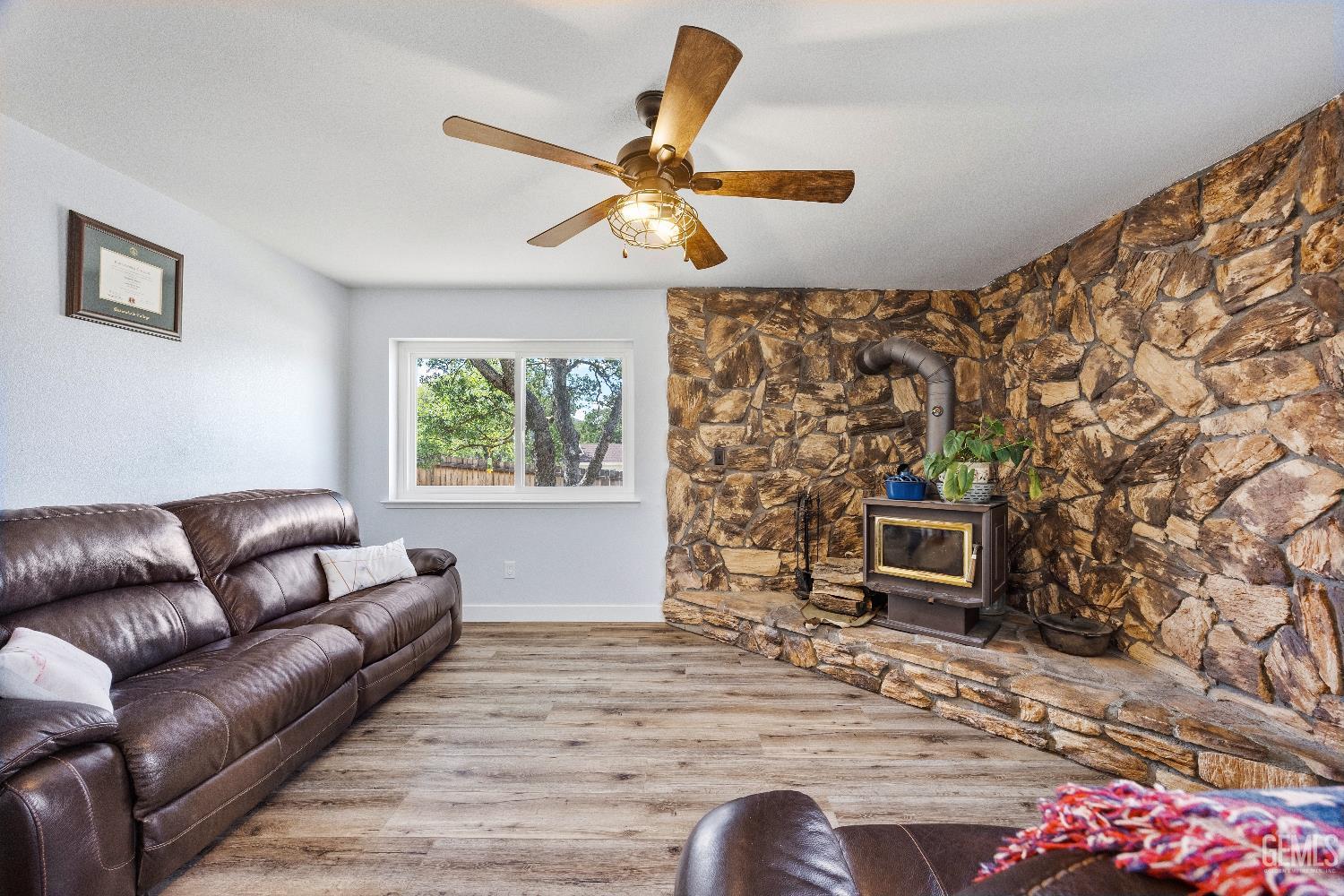 Undisclosed Address Tehachapi, CA 93561 - Photo 8 of 46 a living room with furniture and a fireplace