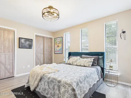 a bedroom with a bed and a television
