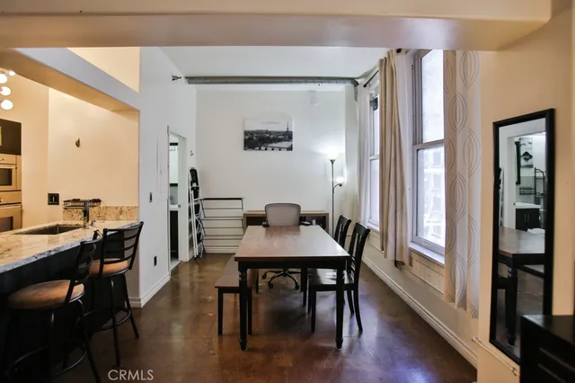 a view of a dining room with furniture and window