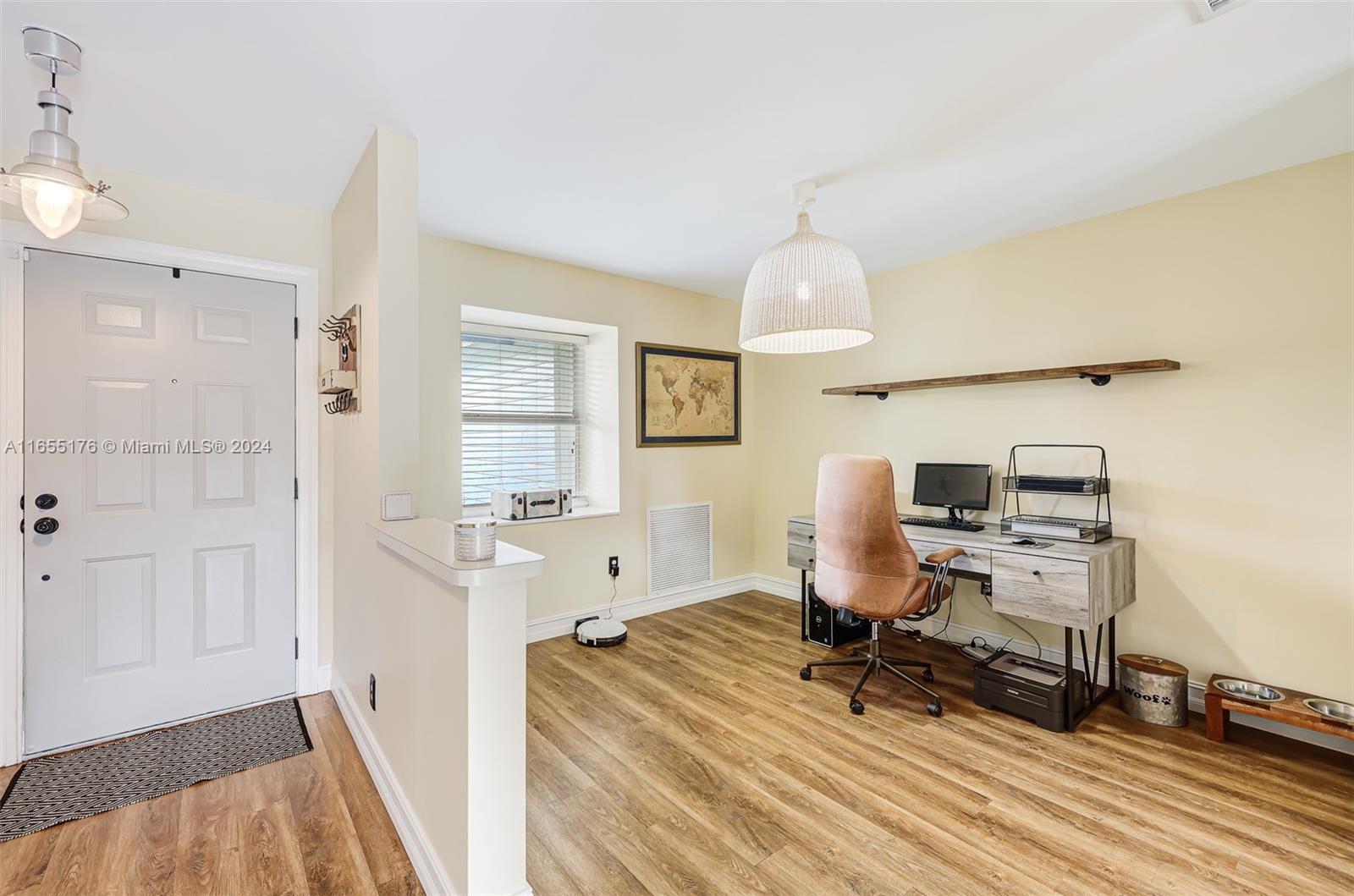14871 Southwest 156th Street Miami, FL 33187 - Photo 11 of 84 a view of a workspace with furniture and a window