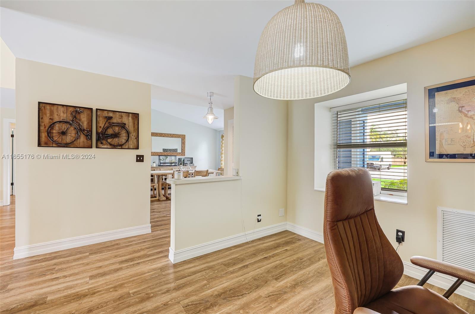 14871 Southwest 156th Street Miami, FL 33187 - Photo 13 of 84 a view of a livingroom with furniture and wooden floor