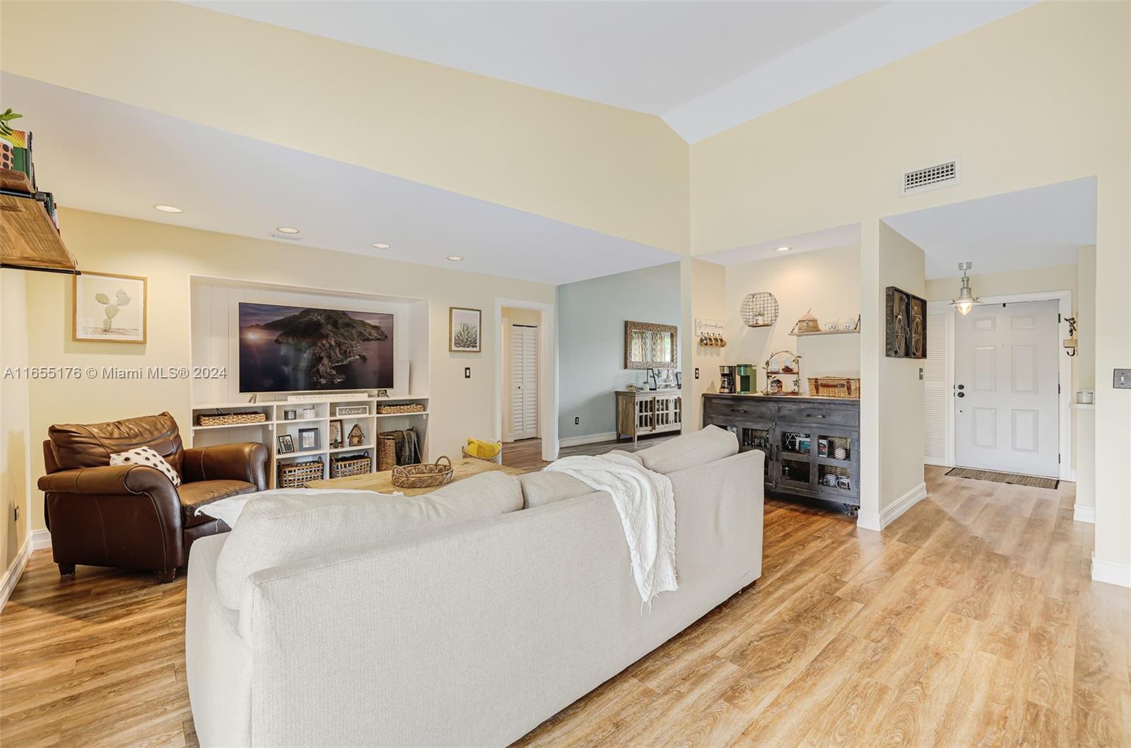 14871 Southwest 156th Street Miami, FL 33187 - Photo 15 of 84 a living room with furniture and a flat screen tv