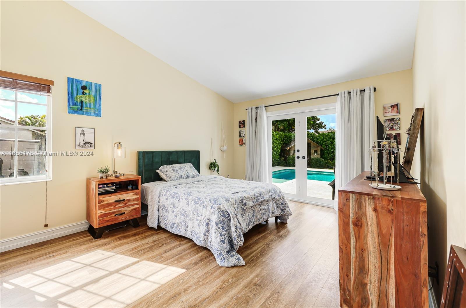 14871 Southwest 156th Street Miami, FL 33187 - Photo 24 of 84 a bedroom with a bed and a window