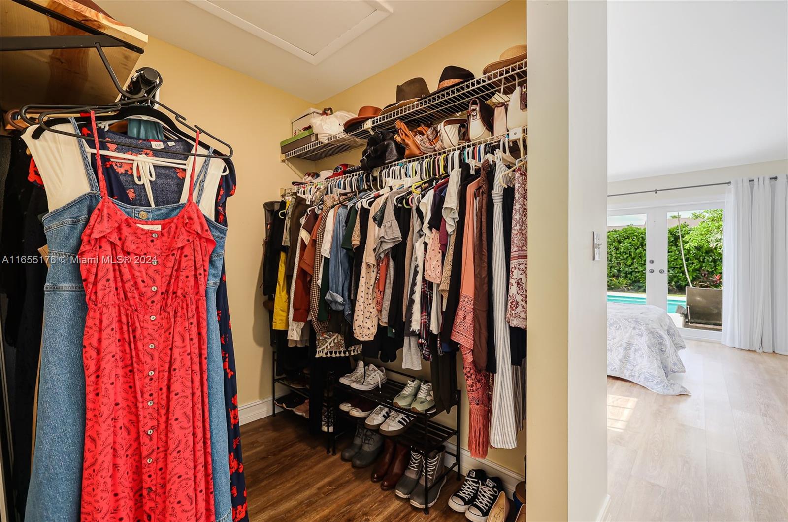14871 Southwest 156th Street Miami, FL 33187 - Photo 31 of 84 a view of walk in closet with clothes and shoes