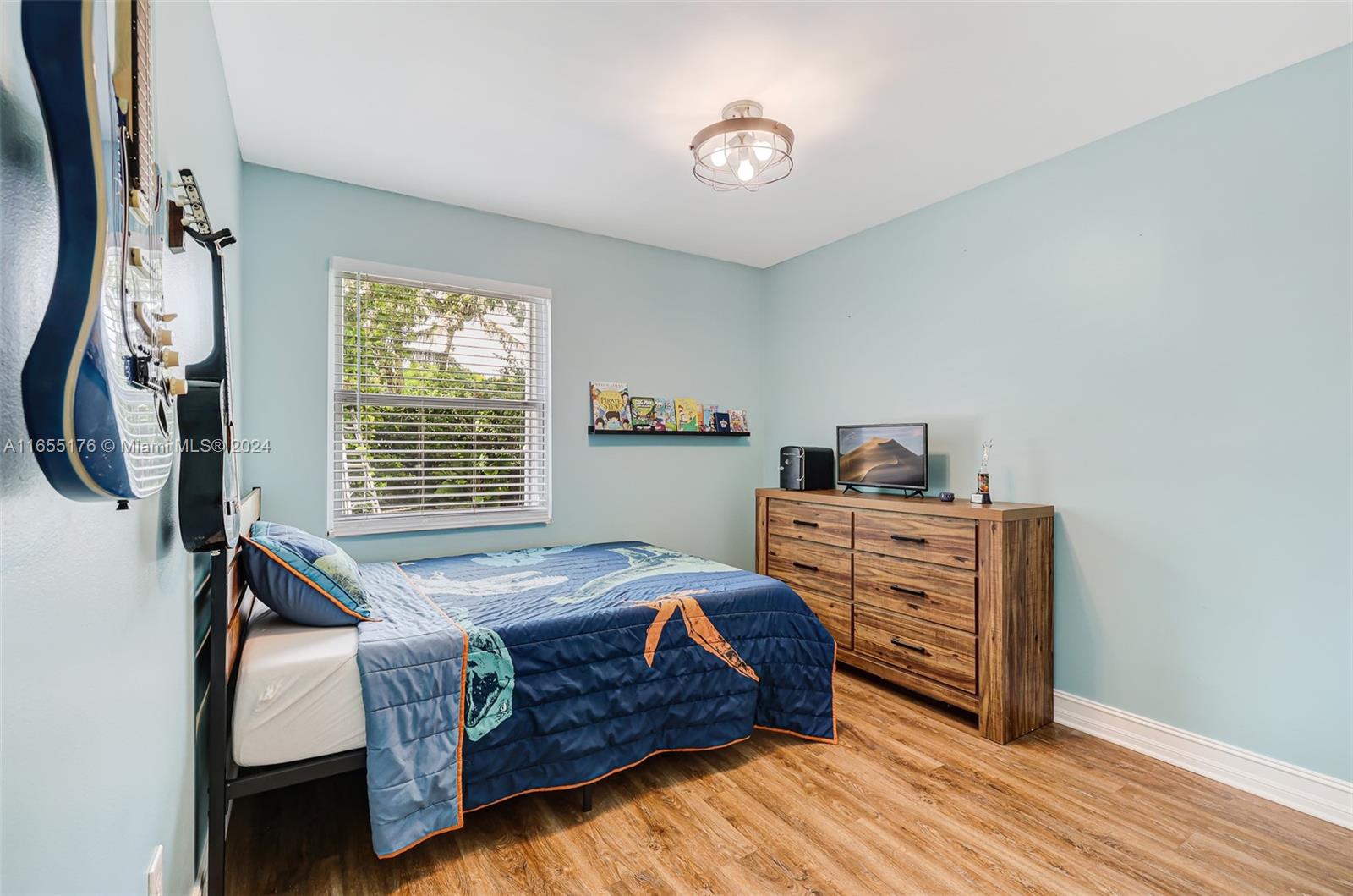 14871 Southwest 156th Street Miami, FL 33187 - Photo 33 of 84 a bedroom with a bed and a window