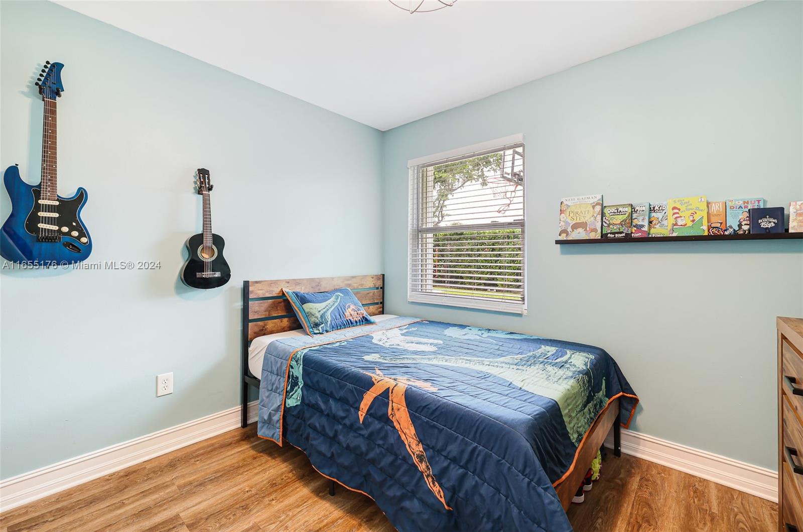 14871 Southwest 156th Street Miami, FL 33187 - Photo 34 of 84 a bedroom with bed and a window