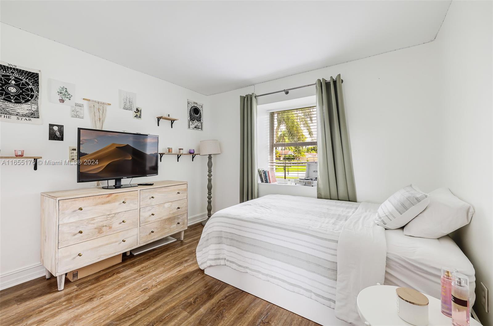 14871 Southwest 156th Street Miami, FL 33187 - Photo 37 of 84 a bedroom with a bed and a window