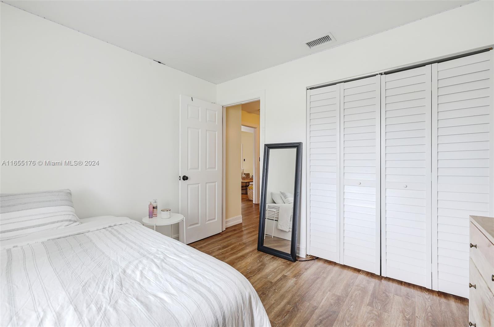 14871 Southwest 156th Street Miami, FL 33187 - Photo 38 of 84 a bedroom with a bed and a closet