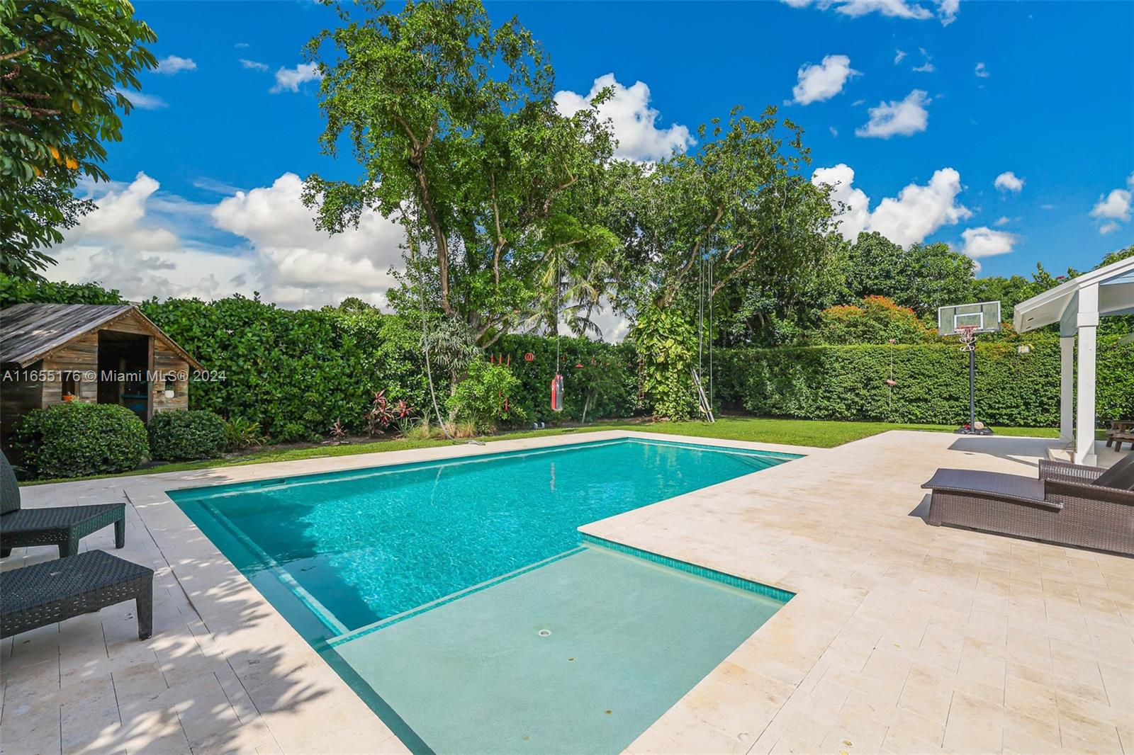 14871 Southwest 156th Street Miami, FL 33187 - Photo 46 of 84 a view of a backyard with a garden