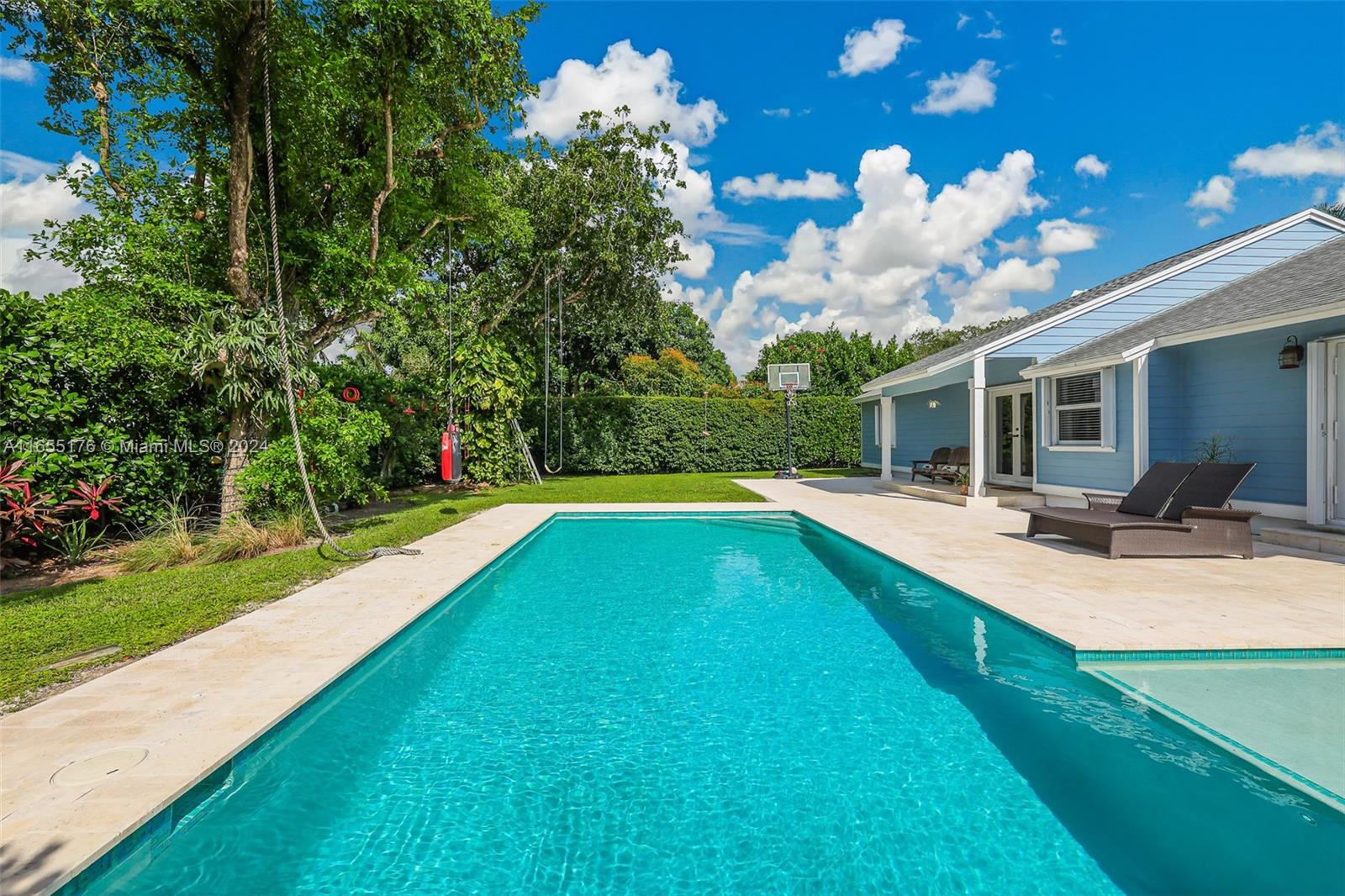 14871 Southwest 156th Street Miami, FL 33187 - Photo 47 of 84 a view of a house with swimming pool yard and patio