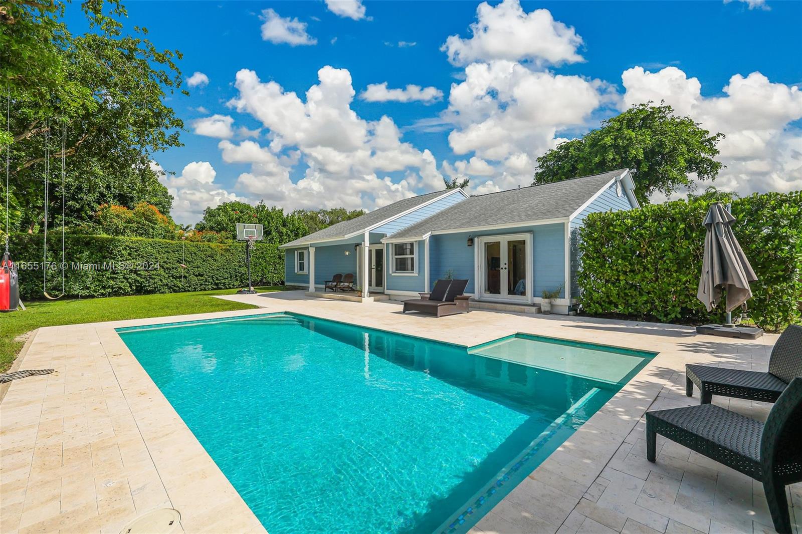 14871 Southwest 156th Street Miami, FL 33187 - Photo 48 of 84 a view of a house with swimming pool and a yard