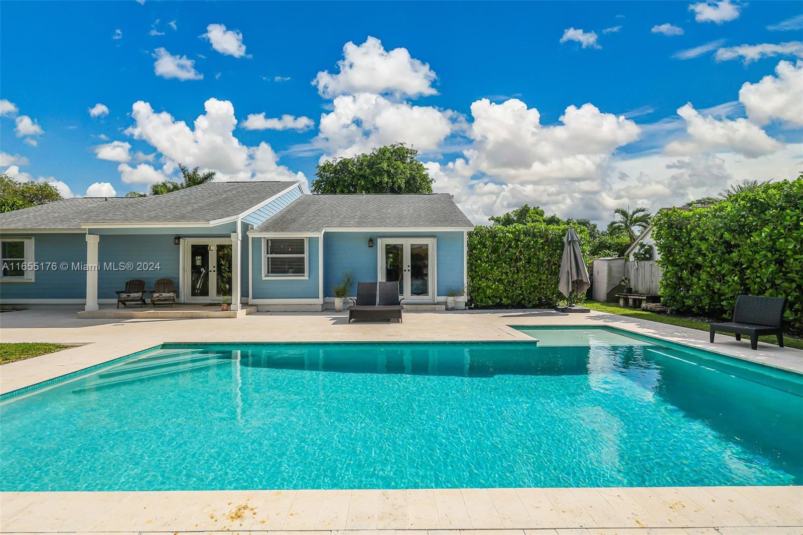 14871 Southwest 156th Street Miami, FL 33187 - Photo 50 of 84 a view of a house with swimming pool having back yard