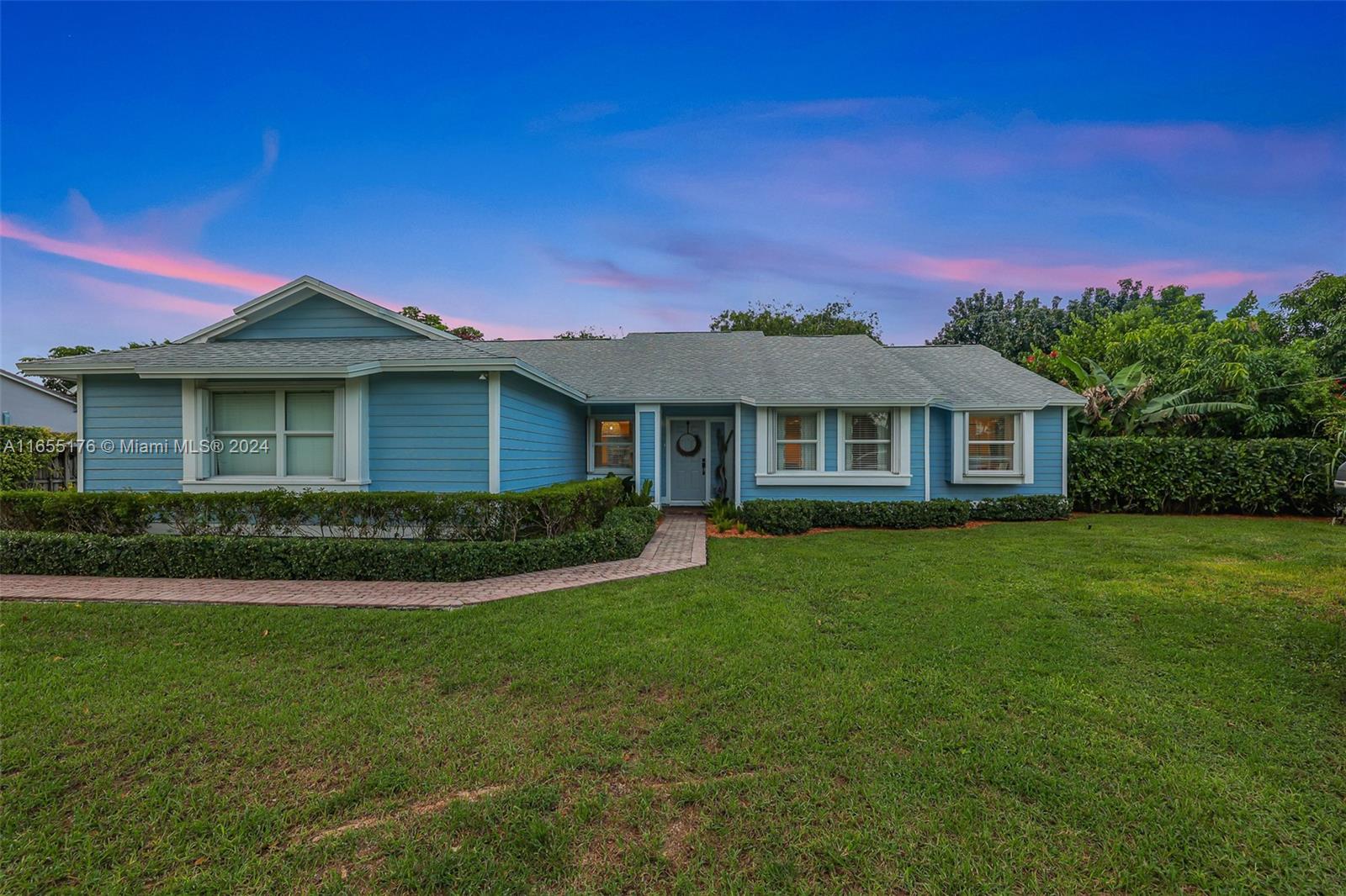 14871 Southwest 156th Street Miami, FL 33187 - Photo 54 of 84 a front view of a house with a garden