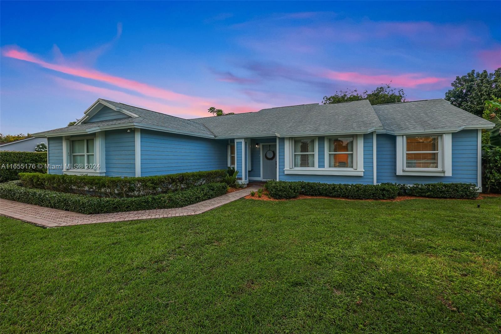 14871 Southwest 156th Street Miami, FL 33187 - Photo 55 of 84 a front view of a house with a garden