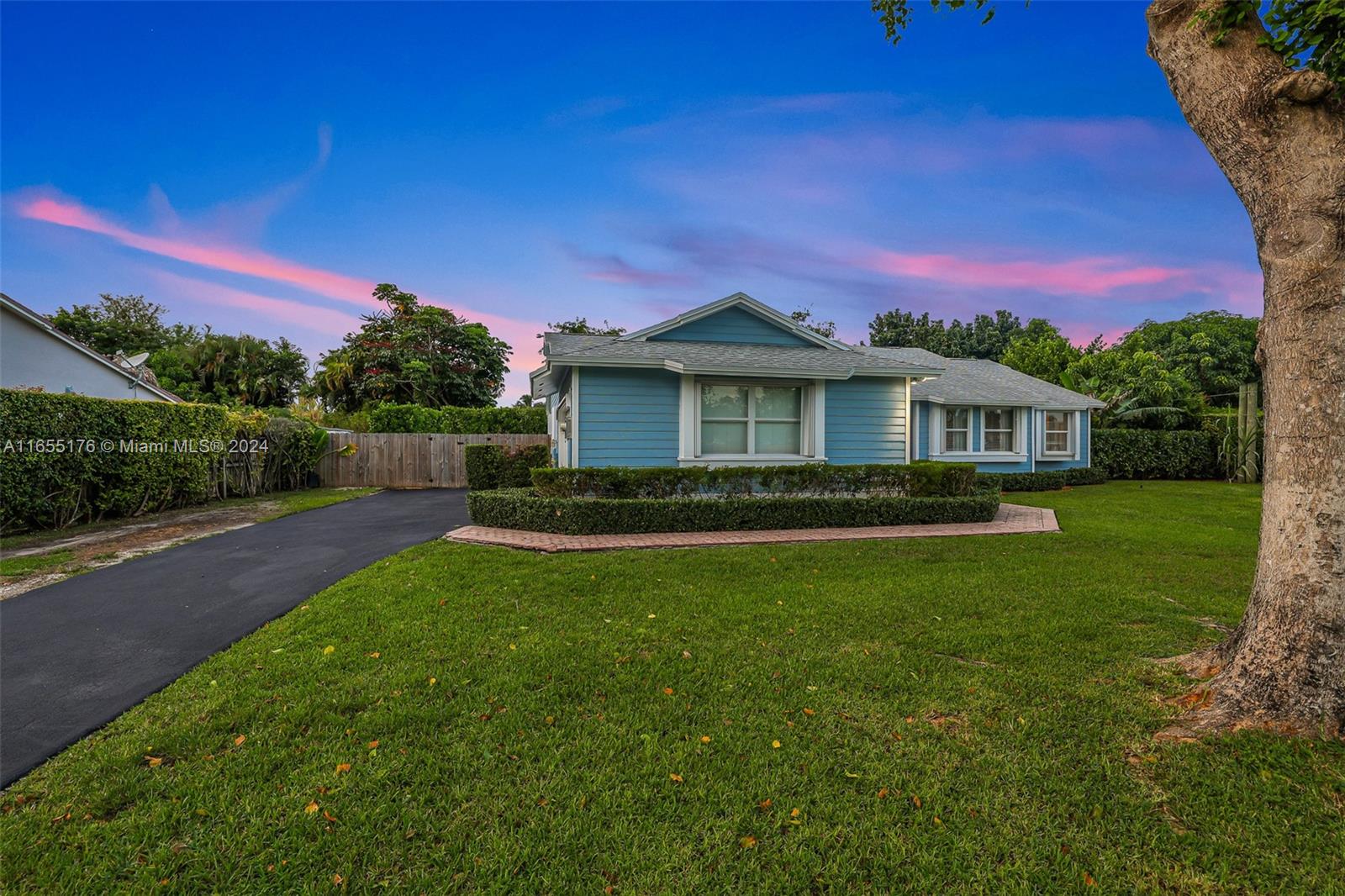 14871 Southwest 156th Street Miami, FL 33187 - Photo 56 of 84 a front view of a house with a yard
