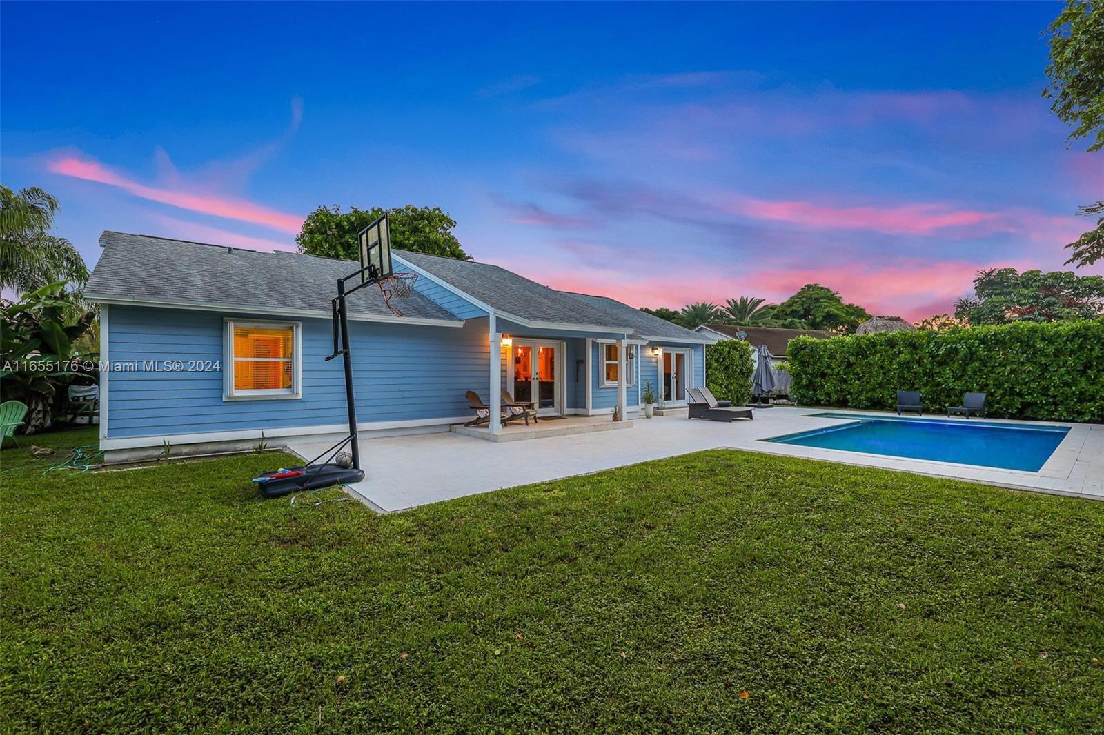 14871 Southwest 156th Street Miami, FL 33187 - Photo 60 of 84 a front view of a house with a yard